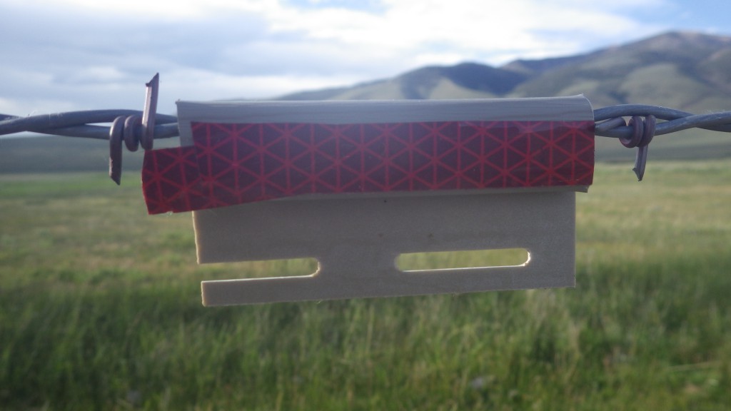 Reflective fence markers increase the visibility of the top wires, preventing sage grouse collisions. (Steve Stuebner photo)