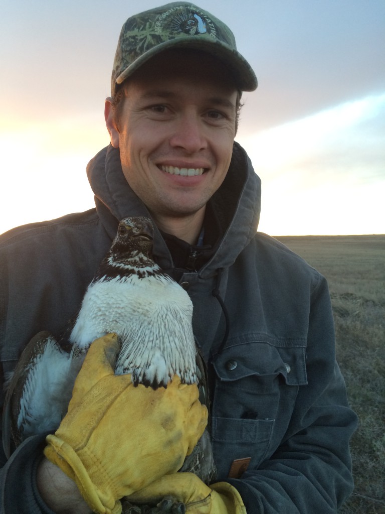 Michael Brown, Range & Wildlife Conservationist with Pheasants Forever, Inc. and Quail Forever, holding a sage grouse.