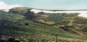 Snow blows into drifts in a treeless sagebrush landscape, increasing water availability later in the year.