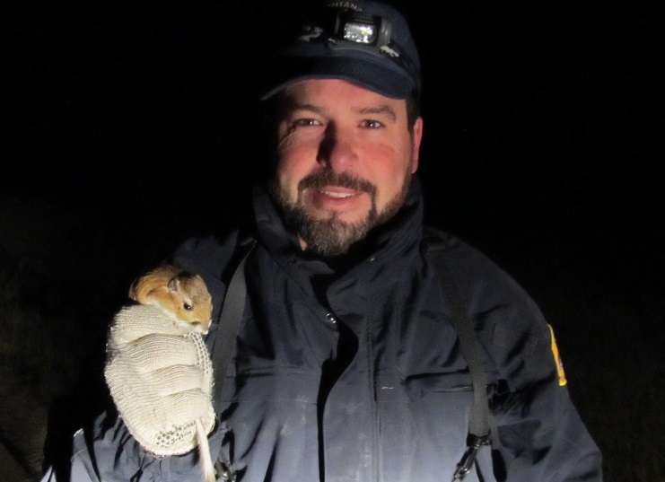 Mark Szczypinski holds a kangaroo rat, another critter that depends on healthy sagebrush habitat.