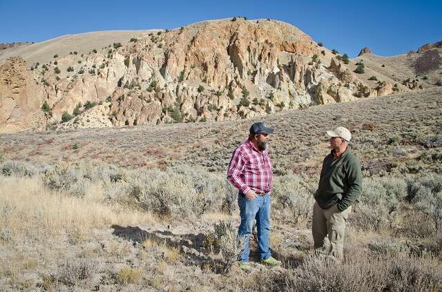 Mike discusses how removing conifers from his ranch has improved wildlife habitat and overall ranch operations with NRCS district conservationist Lynn Larsen.