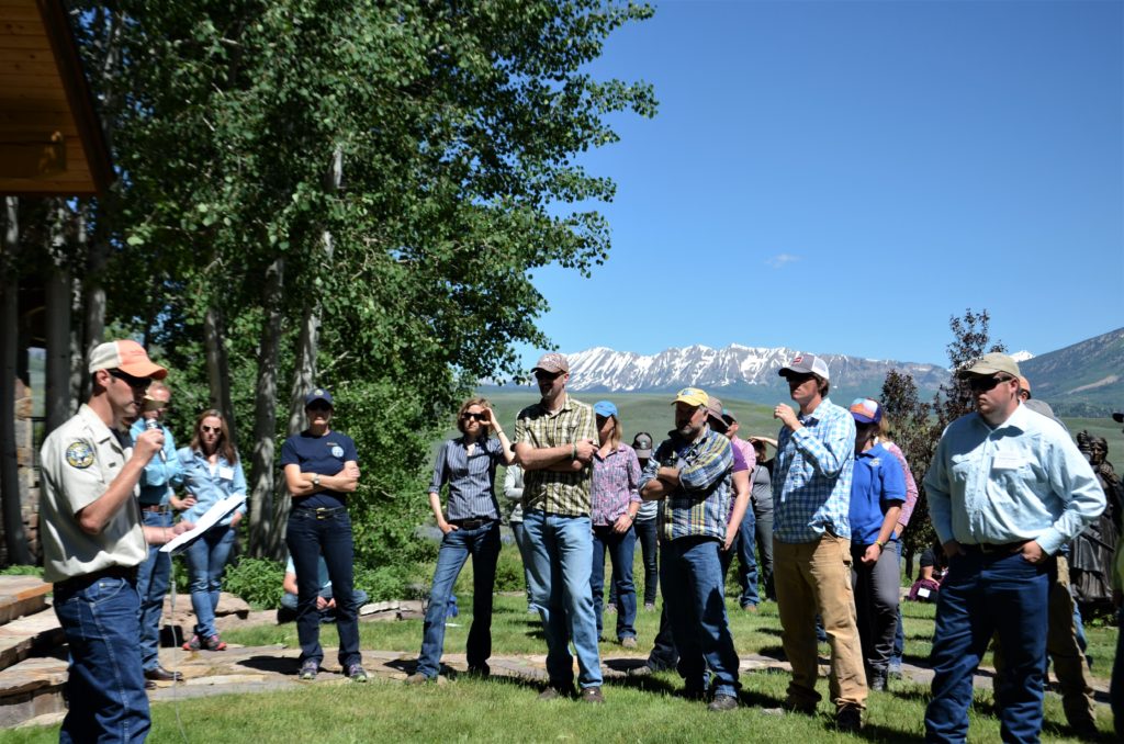 Nate Seward, terrestrial biologist with Colorado Parks and Wildlife, speaks about how grazing is compatible with the life cycle and habitat needs of the threatened Gunnison sage-grouse during the field tour on the Eagle Ridge Ranch. Photo: Brianna Randall