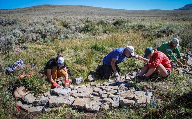 Wildlands Restoration Volunteers building a one rock dam at West Flat Top. Photo: Betsy Neely