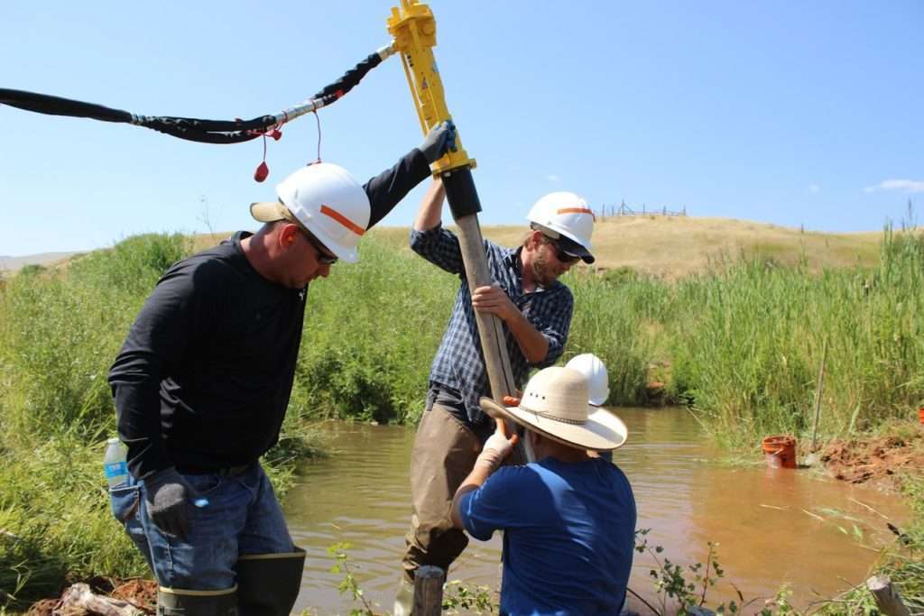 Anyone can learn to install low-tech restoration stream restoration structures, which is why it's sometimes called "blue collar conservation." Photo: John Coffman