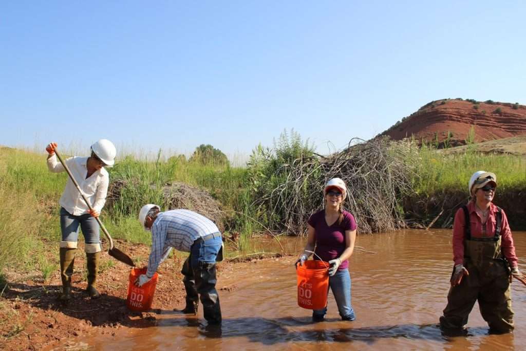All it takes is some shovels, some buckets, and a little sweat to install low-tech restoration structures that kickstart a stream's natural processes. Photo: John Coffman